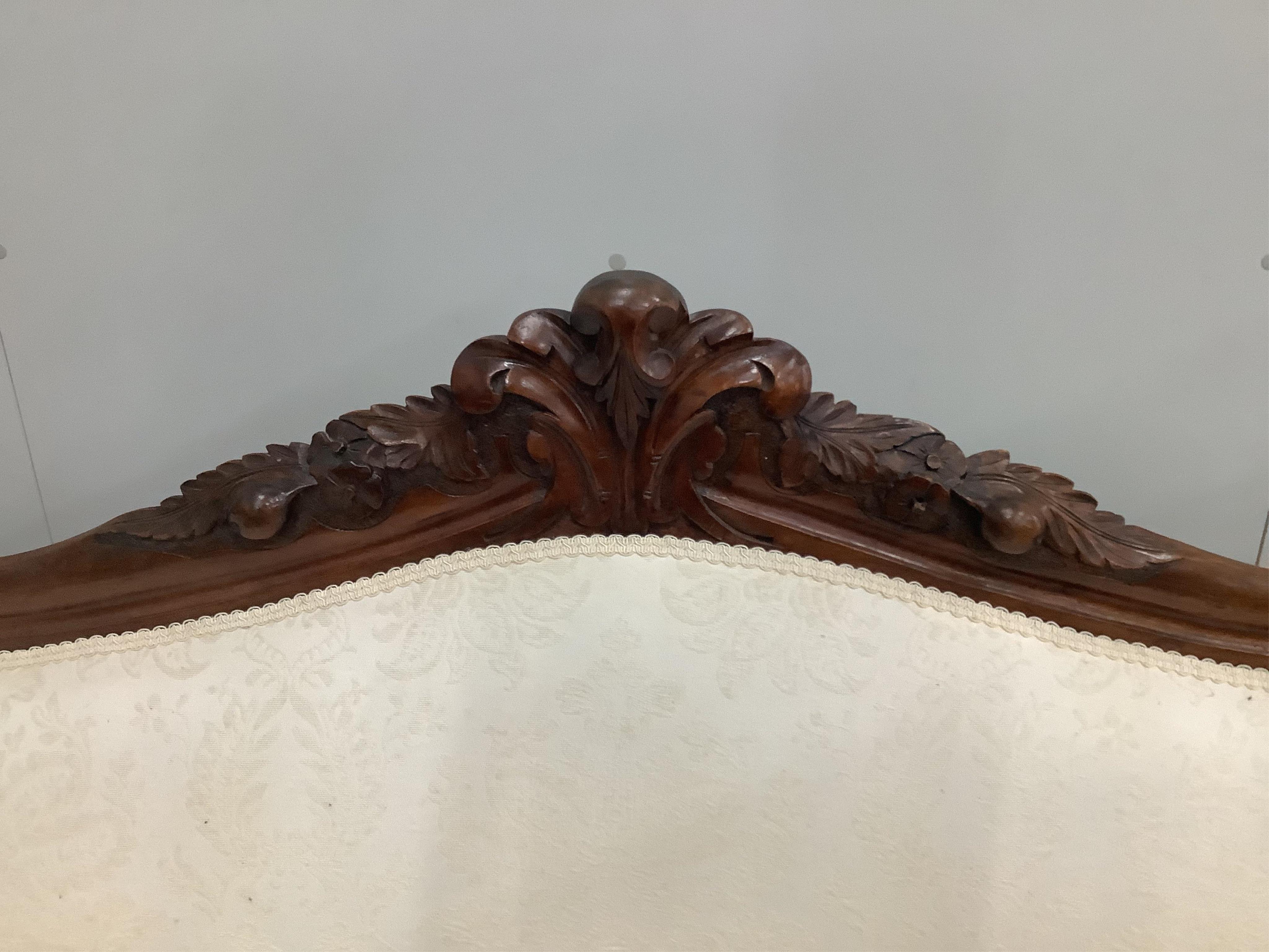 A Victorian mahogany scroll arm settee, width 194cm, depth 59cm, height 96cm. Condition - good